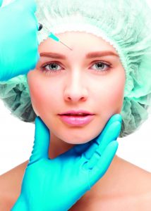 11955225 - close-up shot of cosmetic injection of botox to the pretty female face. isolated on white background