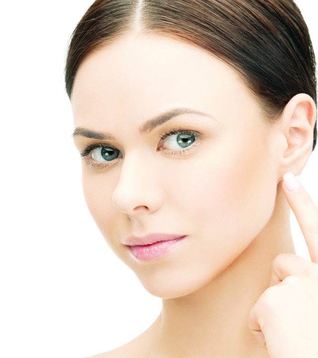 53628837 – face of beautiful woman touching her ear