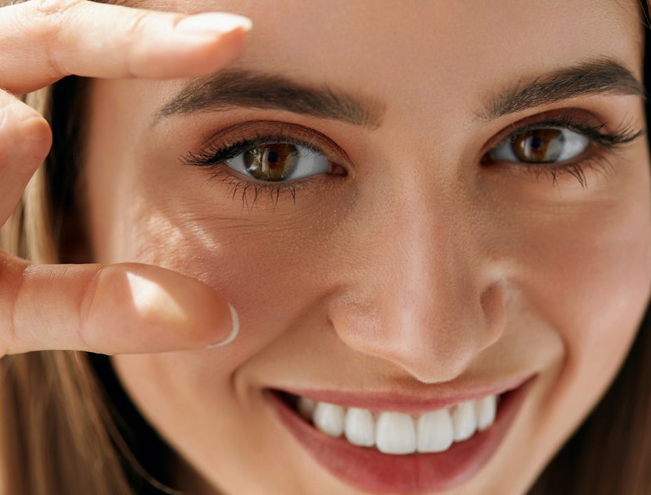 Closeup Of Beautiful Smiling Young Woman With Natural Makeup